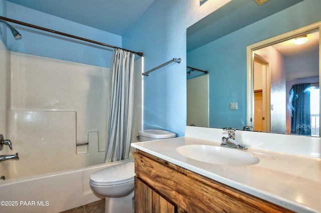 bathroom featuring tile patterned floors, toilet, vanity, and shower / bath combination with curtain