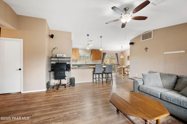 2770 Ridge Rd, Prescott, AZ 86301 - living area featuring a ceiling fan, light wood finished floors, vaulted ceiling, and an office area