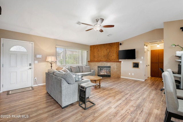 2770 Ridge Rd, Prescott, AZ 86301 - living room with ceiling fan, lofted ceiling, light wood finished floors, and a tile fireplace