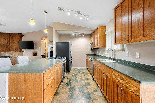 2770 Ridge Rd, Prescott, AZ 86301 - kitchen with appliances with stainless steel finishes, track lighting, brown cabinetry, and dark countertops