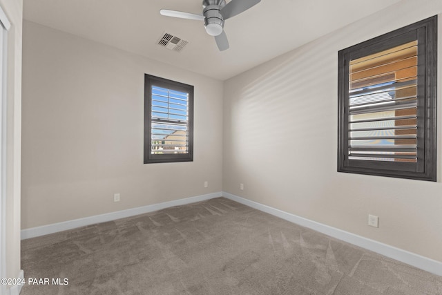 carpeted empty room with ceiling fan