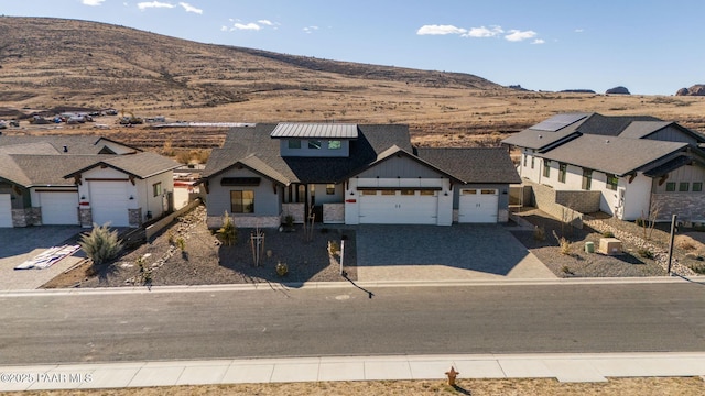 4655 E Alma Ln, Prescott Valley, AZ 86314 - modern farmhouse featuring board and batten siding, a mountain view, driveway, and a garage