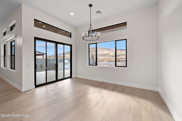 4655 E Alma Ln, Prescott Valley, AZ 86314 - empty room with a chandelier, light wood-style floors, and recessed lighting