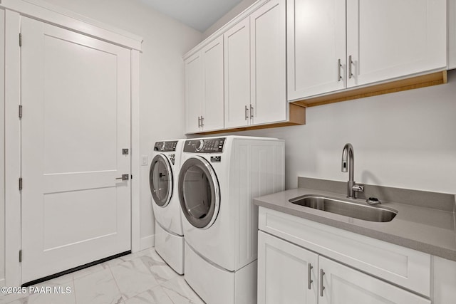 4655 E Alma Ln, Prescott Valley, AZ 86314 - laundry area featuring washer and clothes dryer, light marble finish floors, and cabinet space