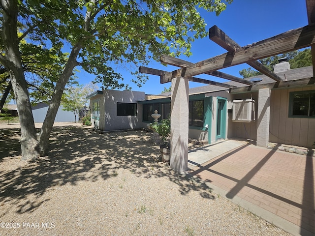 7521 Paseo Hermoso, Prescott Valley, AZ 86314 - back of house with a patio area