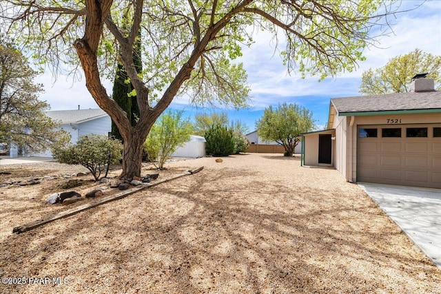 7521 Paseo Hermoso, Prescott Valley, AZ 86314 - view of yard featuring a garage and fence
