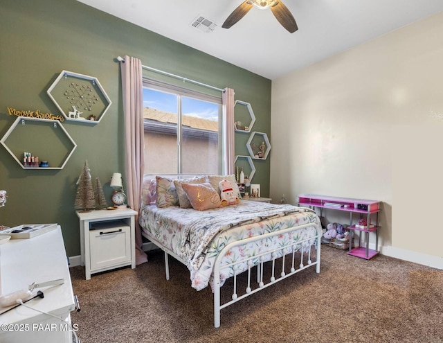 carpeted bedroom featuring visible vents and a ceiling fan