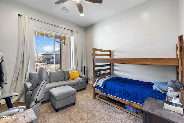 carpeted bedroom with ceiling fan and visible vents