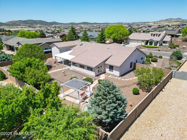 drone / aerial view featuring a mountain view and a residential view