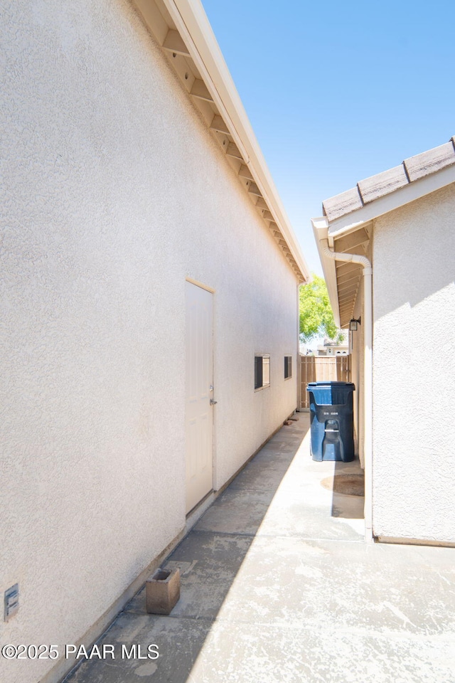 view of patio featuring fence