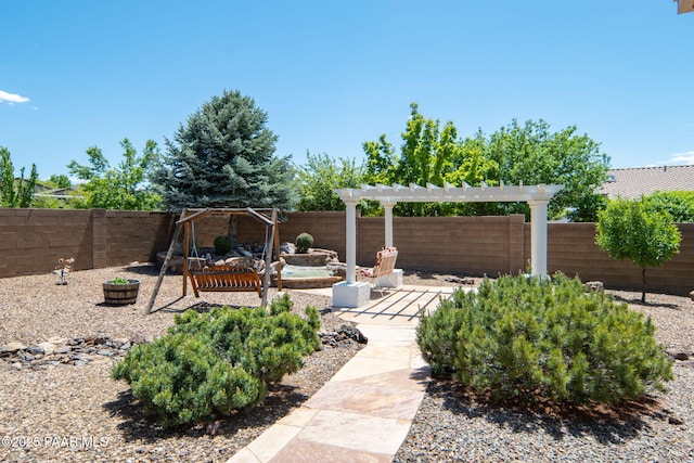 view of yard with a fenced backyard and a pergola