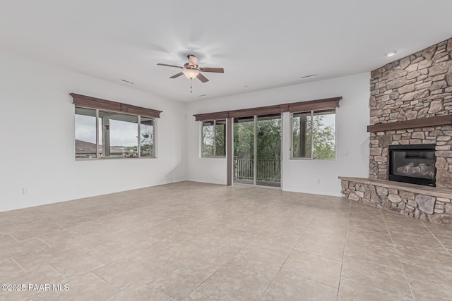 893 Canyon Breeze Ct, Prescott, AZ 86303 - unfurnished living room featuring a ceiling fan, a fireplace, and tile patterned floors