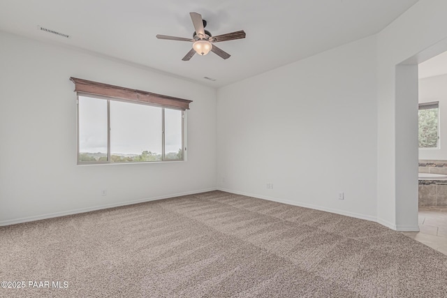 893 Canyon Breeze Ct, Prescott, AZ 86303 - unfurnished room with light carpet, a ceiling fan, and baseboards