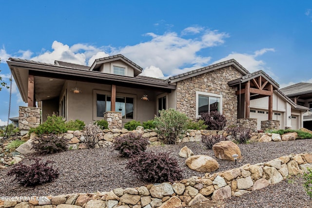 893 Canyon Breeze Ct, Prescott, AZ 86303 - view of front of house featuring stone siding, stucco siding, and a garage