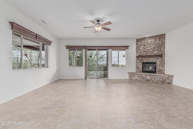 893 Canyon Breeze Ct, Prescott, AZ 86303 - unfurnished living room with a ceiling fan, a stone fireplace, and light tile patterned floors