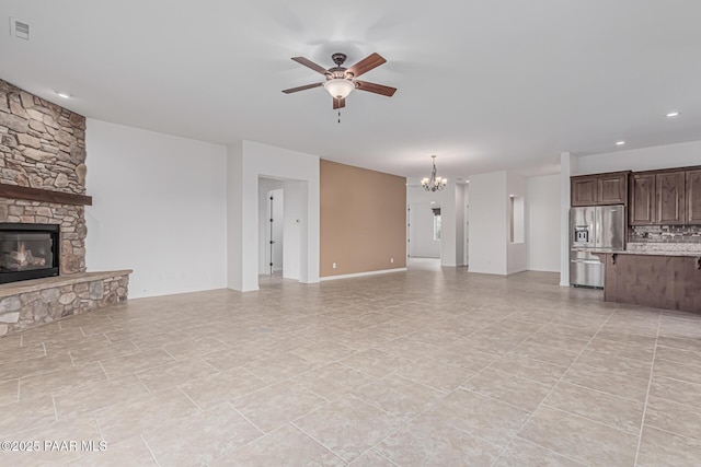 893 Canyon Breeze Ct, Prescott, AZ 86303 - unfurnished living room with a chandelier, a ceiling fan, a fireplace, and recessed lighting