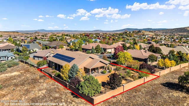 birds eye view of property with a mountain view