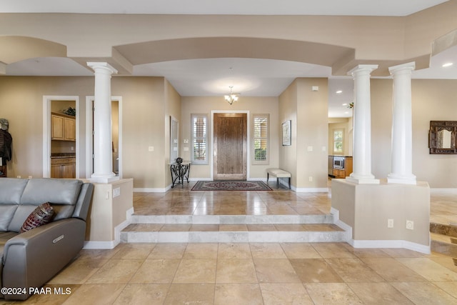 entryway with an inviting chandelier