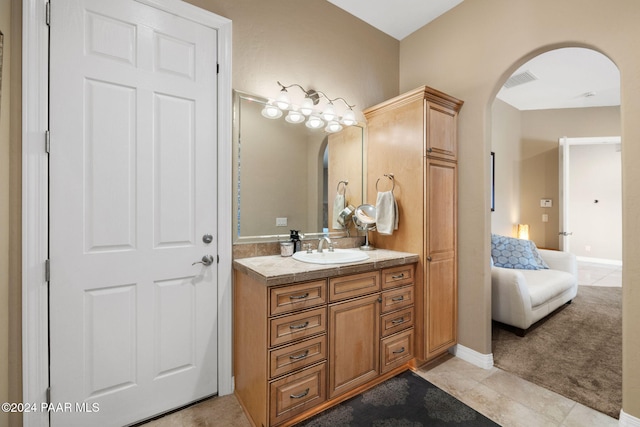 bathroom featuring tile patterned floors and vanity