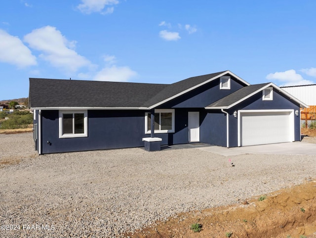 single story home with a garage