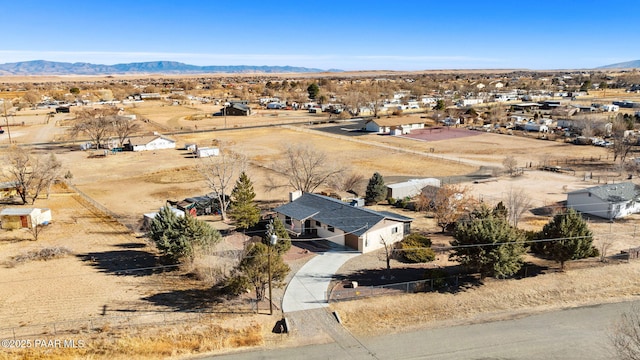 birds eye view of property featuring a mountain view