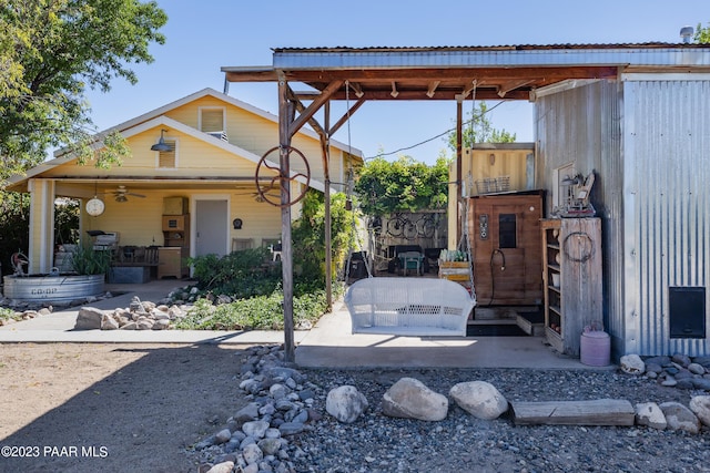 exterior space featuring ceiling fan