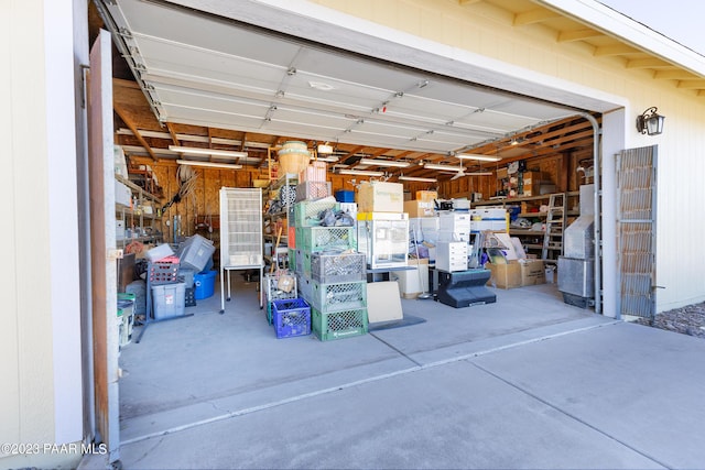 garage featuring wood walls