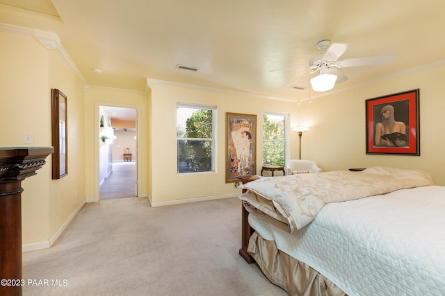 carpeted bedroom featuring ceiling fan and ornamental molding