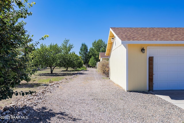 view of side of property with a garage