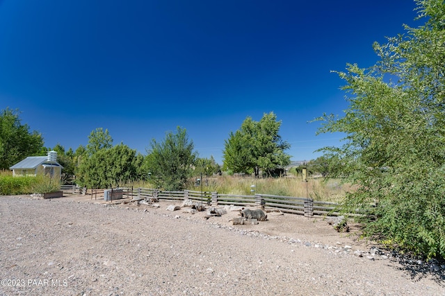 view of yard with a rural view