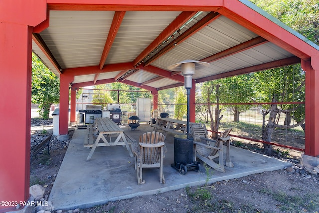 view of patio featuring an outdoor fire pit