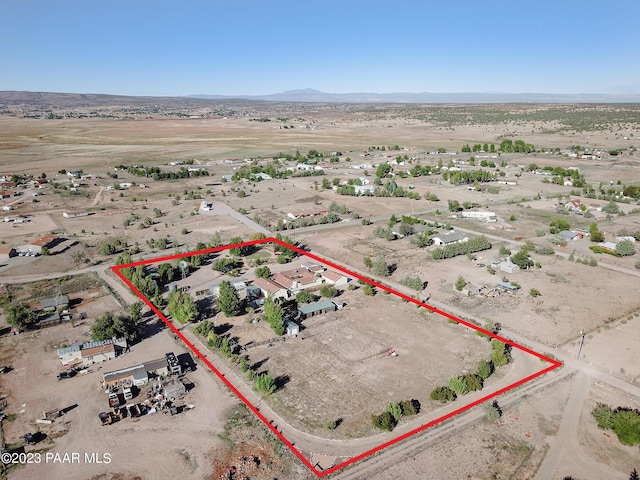 birds eye view of property with a mountain view