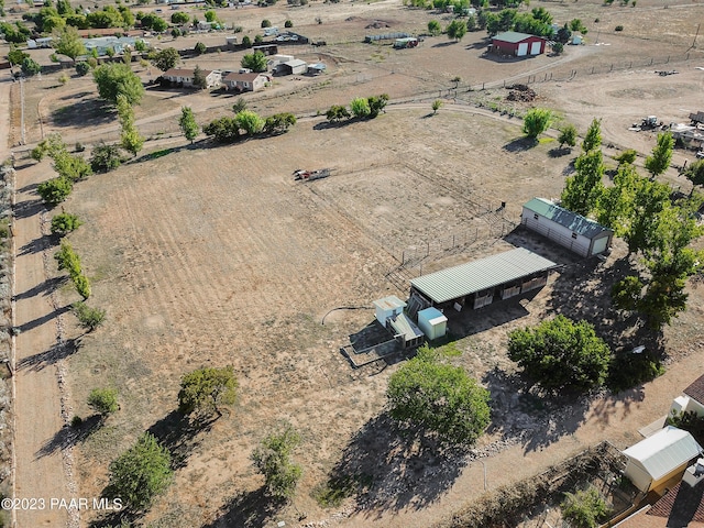 birds eye view of property with a rural view