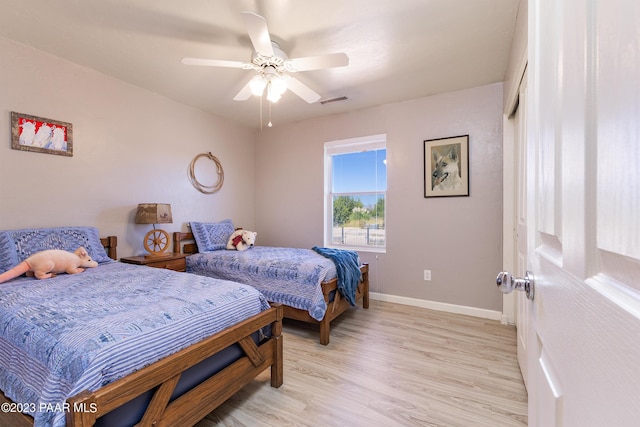 bedroom featuring ceiling fan and light hardwood / wood-style floors