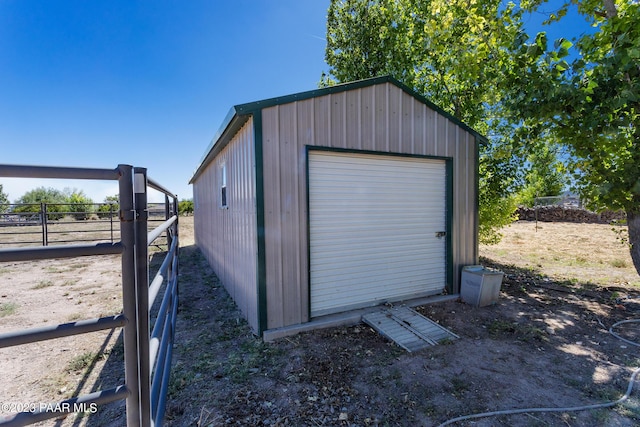 view of outbuilding with a garage