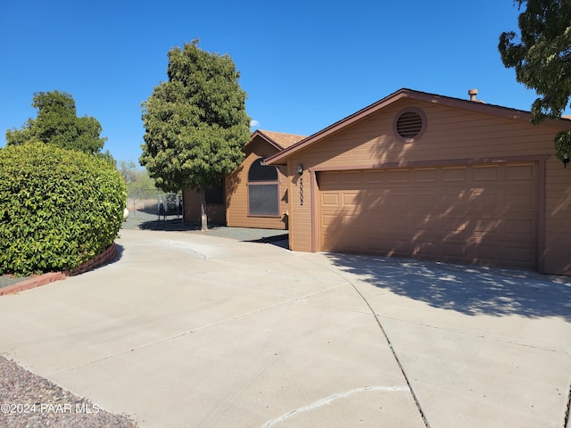 ranch-style home featuring a garage