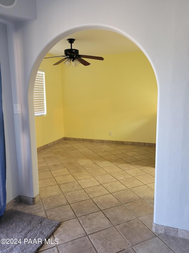 spare room with ceiling fan