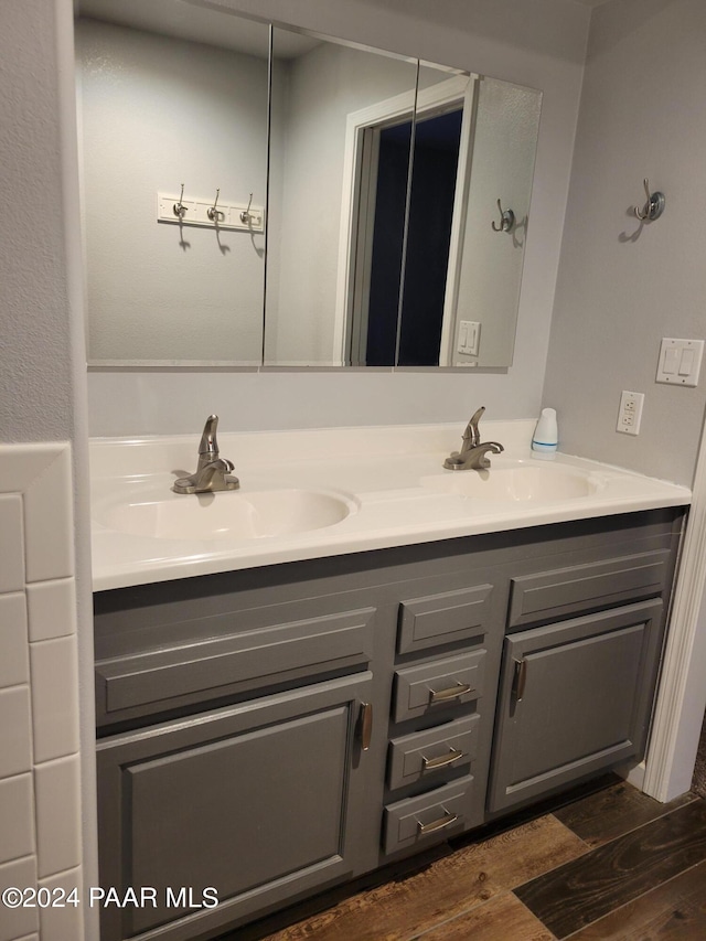 bathroom featuring wood-type flooring and vanity