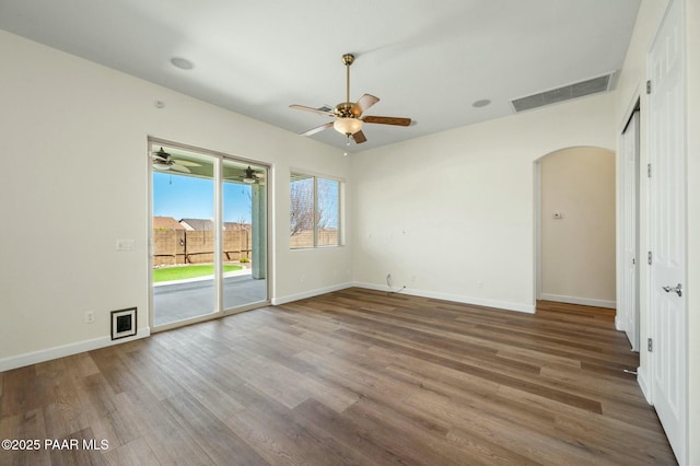 3824 N Wakefield Dr, Prescott Valley, AZ 86314 - spare room with arched walkways, wood finished floors, ceiling fan, and baseboards