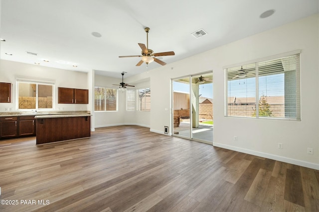 3824 N Wakefield Dr, Prescott Valley, AZ 86314 - unfurnished living room with light wood-type flooring, a ceiling fan, and baseboards