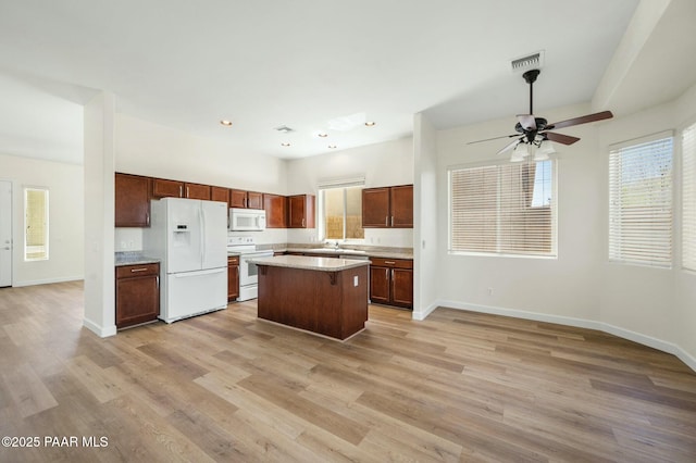 3824 N Wakefield Dr, Prescott Valley, AZ 86314 - kitchen with white appliances, baseboards, light wood-style flooring, and recessed lighting