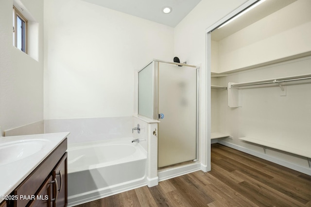 3824 N Wakefield Dr, Prescott Valley, AZ 86314 - full bathroom featuring a shower stall, a garden tub, a spacious closet, and vanity