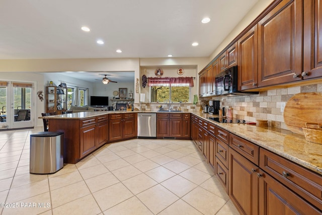 9520 Poland Rd, Mayer, AZ 86333 - kitchen featuring black appliances, a sink, a peninsula, recessed lighting, and light stone counters