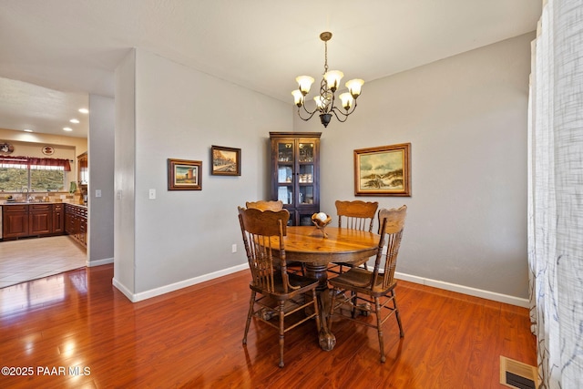 9520 Poland Rd, Mayer, AZ 86333 - dining area with a chandelier, baseboards, light wood-style flooring, and recessed lighting
