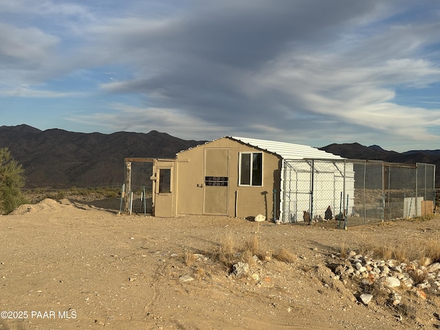 view of outdoor structure with a mountain view