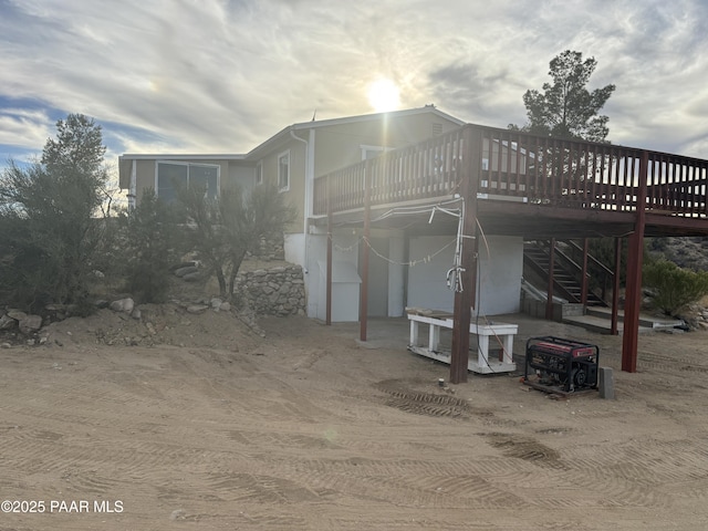 view of home's exterior featuring a wooden deck