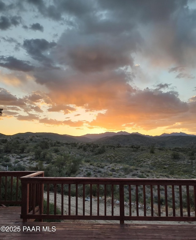 deck at dusk with a mountain view