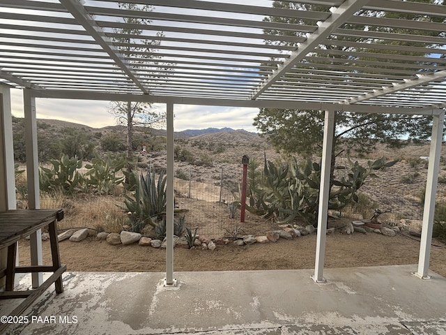 view of patio featuring a mountain view and a pergola