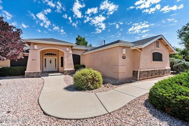 977 Kristin St, Chino Valley, AZ 86323 - view of front of home with stucco siding and stone siding