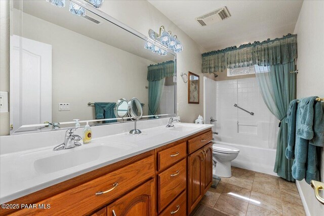 977 Kristin St, Chino Valley, AZ 86323 - full bathroom featuring double vanity, shower / bath combo with shower curtain, and tile patterned floors